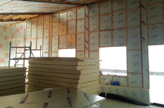 140mm PIR boards between the timber-frame with additional 125mm boards mid-installation inside