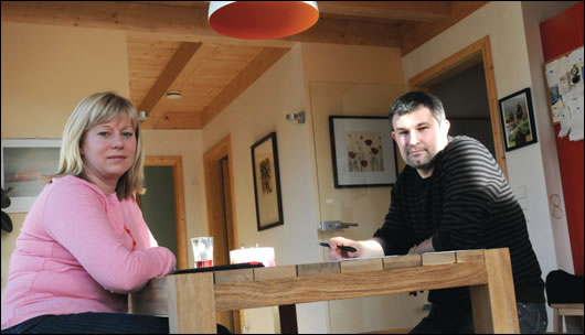 The couple, Pam O’Donnell and Marcel Laskody, at home in their new house