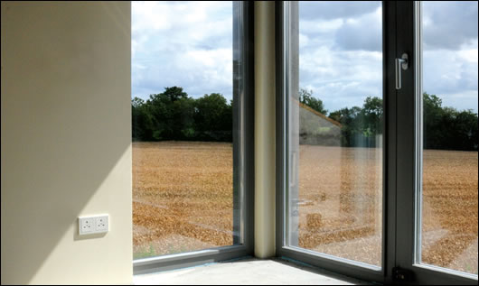 Small windows minimise heat loss to the north; whilst large glazed sections to the south take advantage of passive solar gains, daylight and the scenic view
