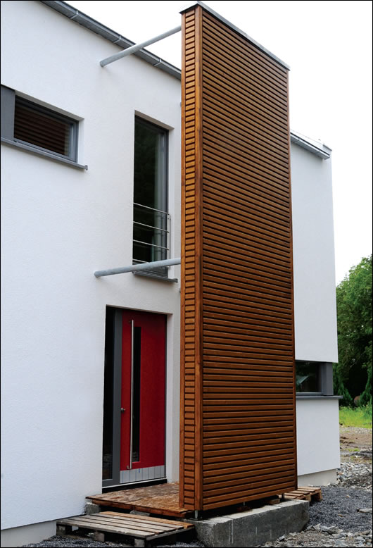 A timber element is both shelter for the front door on the north elevation and architectural statement