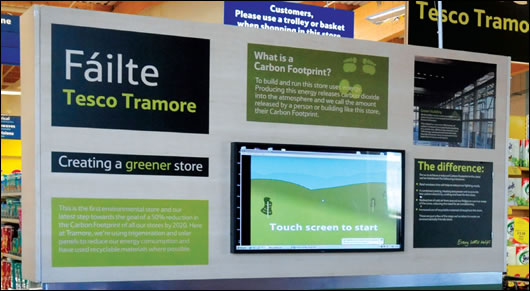 An information display educates shoppers about sustainability upon entering the store