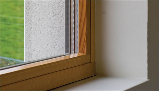 High performance triple glazed windows sit in a substantially thick wall