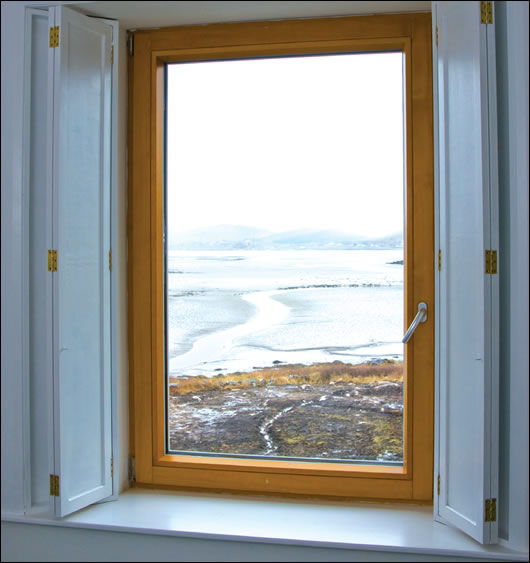 Large windows make the most of impressive views of the sea
