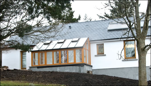 The south facing solar conservatory makes the most of passive solar gain