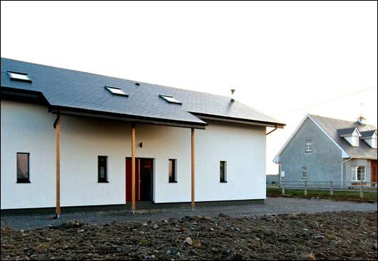 Glazing is minimised on north, east and west elevations although there are three rooflights on the northern roof