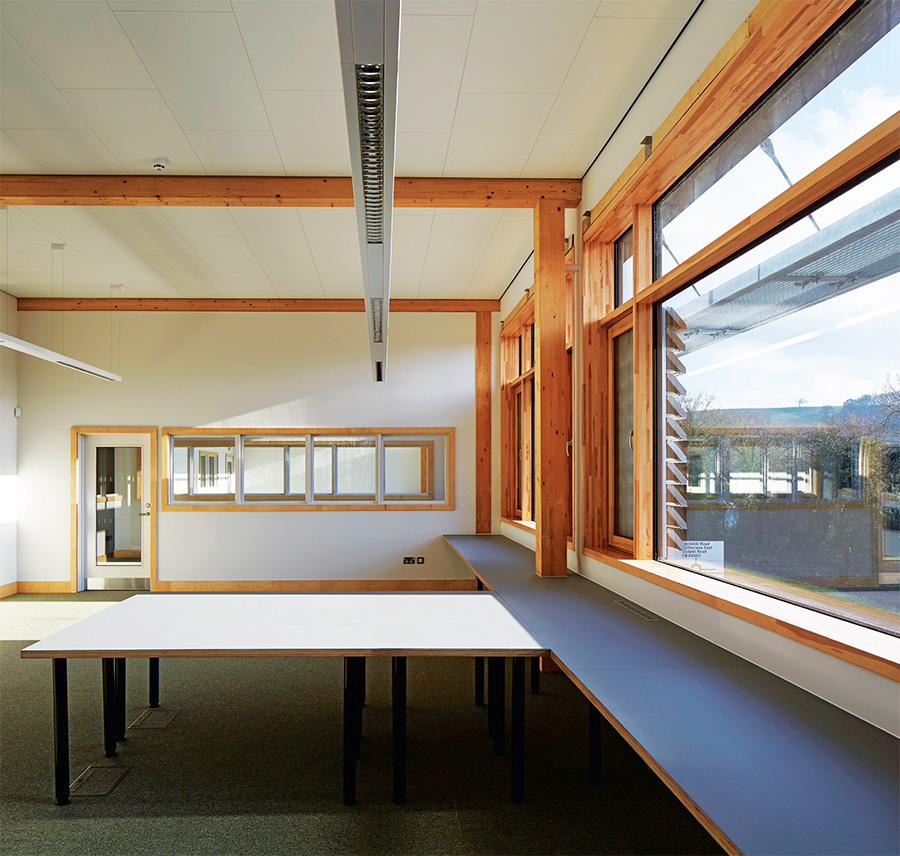 The timber building has a generous amount of glazing to make the most of the views outside, with shading above each run of glass to minimise summer overheating