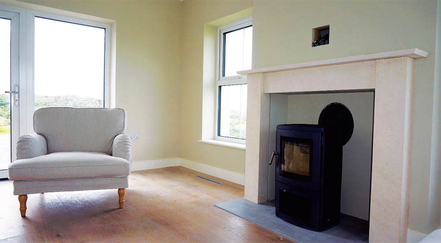 The house features a Chesney Milan 4 Passive room-sealed wood burning stove