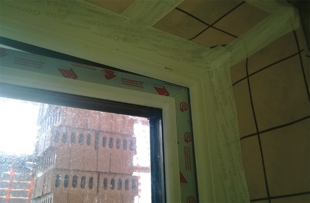 Airtightness taping over joints, while insulated window and door reveals reduce thermal bridging