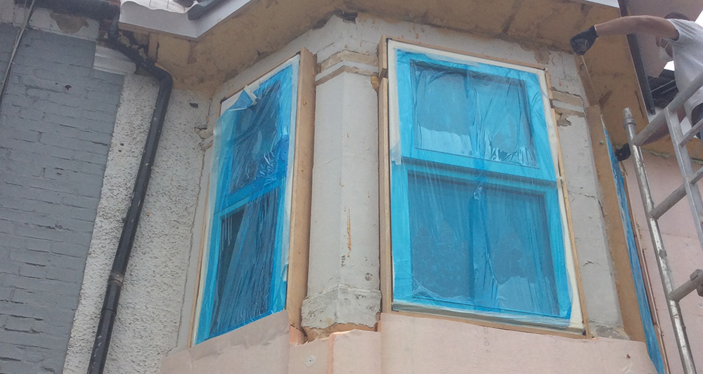 Fixing the external insulation around the two-storey bay window at the front of the house was a particular challenge.