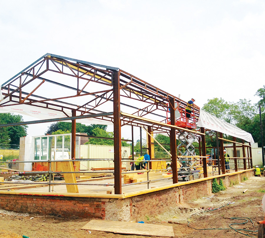 All cladding was removed from the old shed, leaving only the original steel frame, which was left exposed inside the finished studio