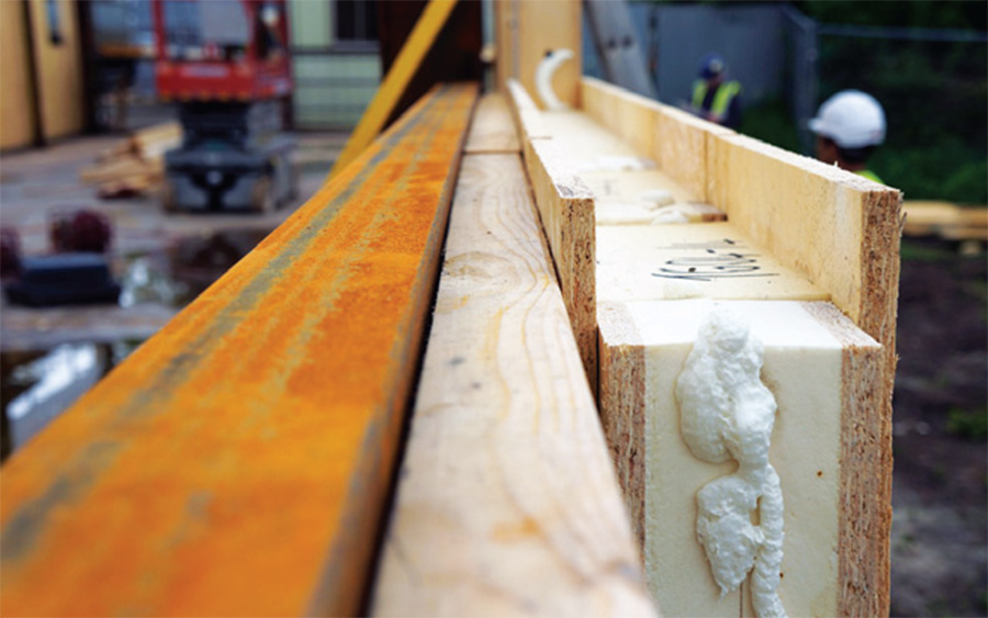 A close-up of one of the panels, which consist of urethane insulation sandwiched between two layers of OSB, outside the steel frame