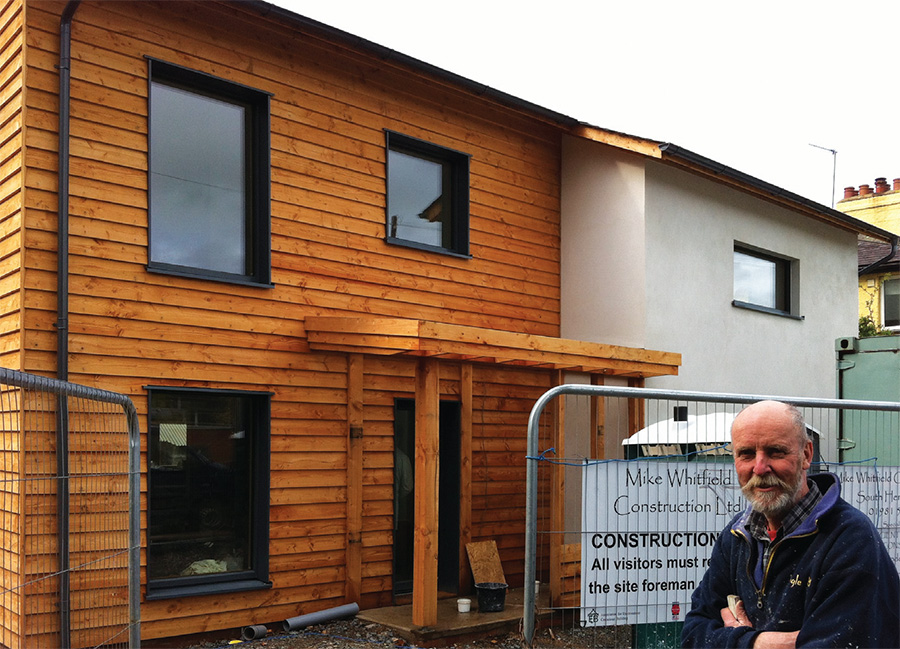 Building contractor Mike Whitfield outside the house as it nears completion