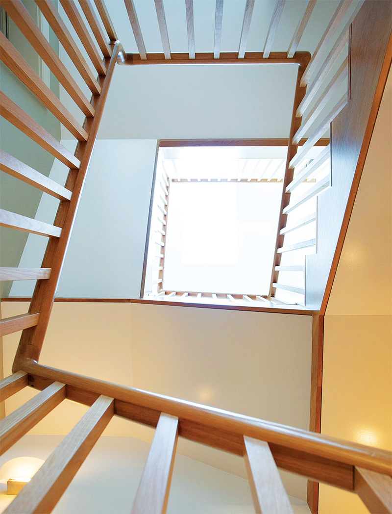 Bespoke roof windows introduce additional heat and light into the core of the house, down through the stairwell