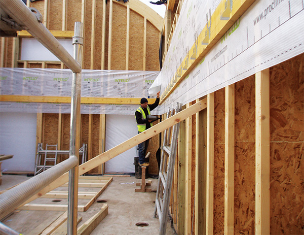 Strips of airtight membrane were fitted before the joist hangers were added to preserve the airtight layer.