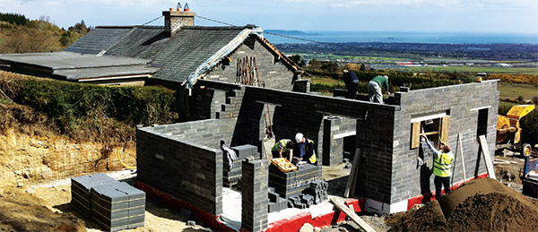 The external walls of the new cottage are concrete block insulated