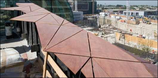 The view from the museum's roof across rapidly developing Sandyford. The external wood cladding can be seen in the foreground and to the left is the upper area of structural glazing 