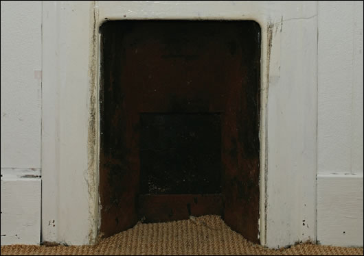 The least energy efficient houses built in Ireland comparatively recently include outmoded technologies such as open fire places (above) and single glazing (below)