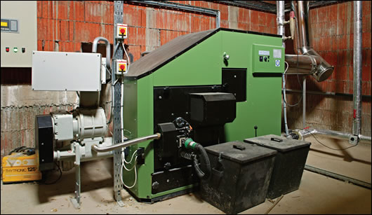 The 100kW HDG wood chip boiler that heats the factory is housed in an underground boiler house