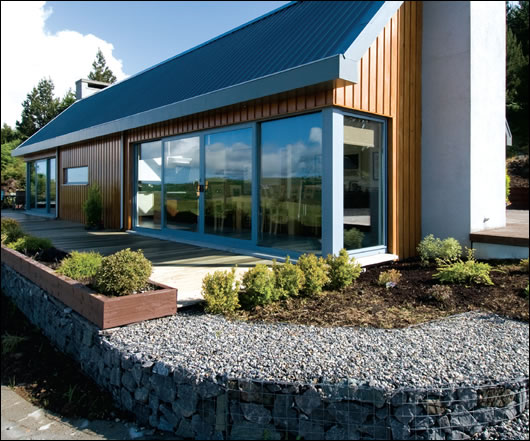 Facing south over Lough Callow, design and layout maximise both views and solar gain