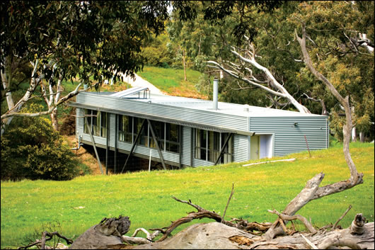 Fitting with the landscape is an often-overlooked part of green building, but the Bridge House does it beautifully