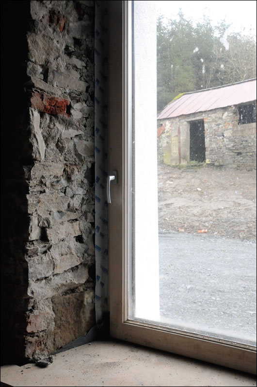 An upgrade in Cavan by architect Frank Cooney, with externally insulated exposed stone walls lending thermal mass