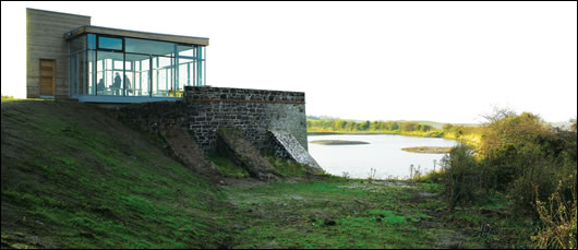 Tthe lime kiln pavilion perched above the renovated stone kiln with timber clad service pod to the rear