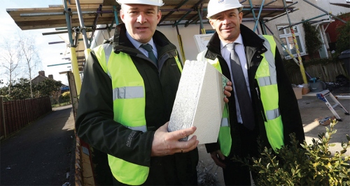 Former energy minister Ed Davey visiting a council house that received external insulation &amp; heating system upgrade under the Energy Company Obligation (Eco) scheme in March 2015